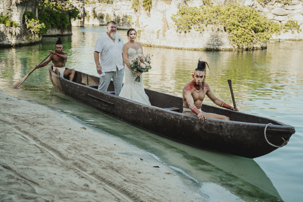 Jhankarlo Photography Canoe Enterance Hotel Xcaret Mexico Wedding for Yellow Umbrella Events