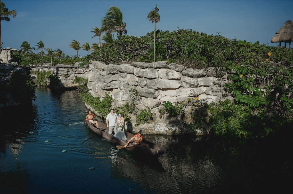 Jhankarlo Photography Canoe Enterance Hotel Xcaret Mexico Wedding for Yellow Umbrella Events