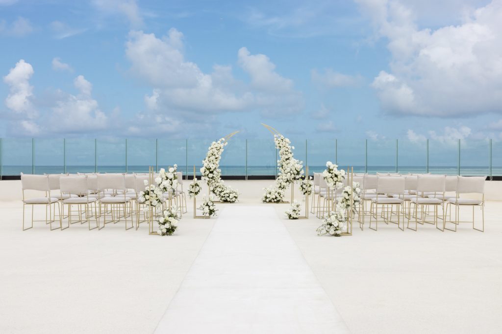 AVA Hotel wedding photo with bride and groom by yellow umbrella events