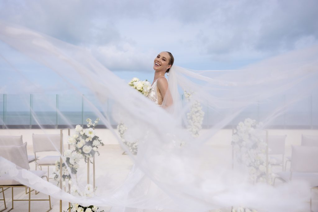AVA Hotel wedding photo with bride and groom by yellow umbrella events