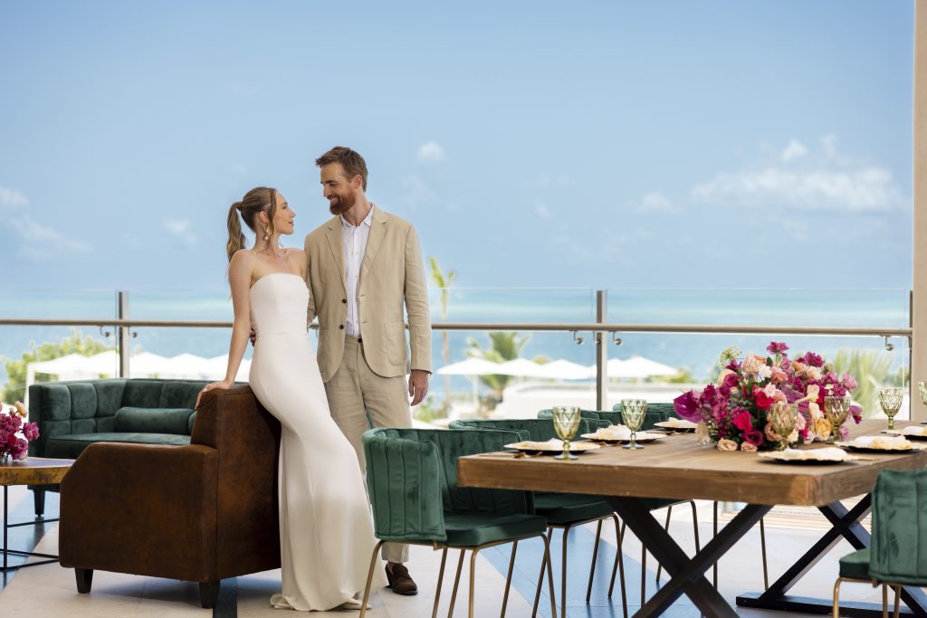 AVA Hotel wedding photo with bride and groom by yellow umbrella events