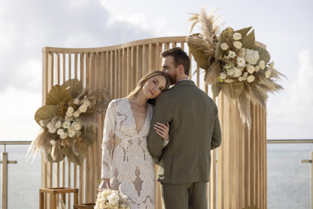 AVA Hotel wedding photo with bride and groom by yellow umbrella events